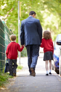 Father Dropping Kids Of At School On Way To Work